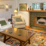 A living room with a fireplace and a couch