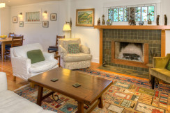 A living room with a fireplace and a couch