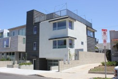 A modern style house with a balcony and a garage.