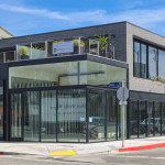 A building with glass windows on the side of it.