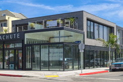 A building with glass windows on the side of it.