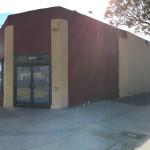 A building with a large window and a door.