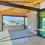 A large open room with glass doors and windows.
