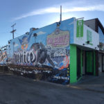 A building with graffiti on the side of it.