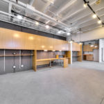 A large room with many wooden cabinets and shelves.