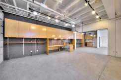 A large room with many wooden cabinets and shelves.