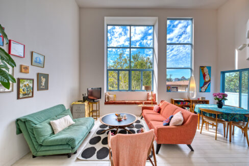 A living room with two couches and a table